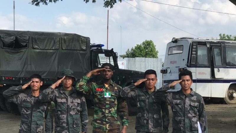 Mr Nigeria Nelson Enwerem rocks military uniform, poses with Philippine Armies